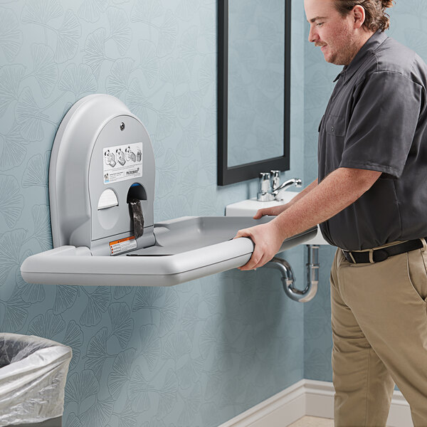 Cambiador de bebé Koala Kare KB300 en plástico HDPE, color gris — horizontal montado en superficie para baños comerciales