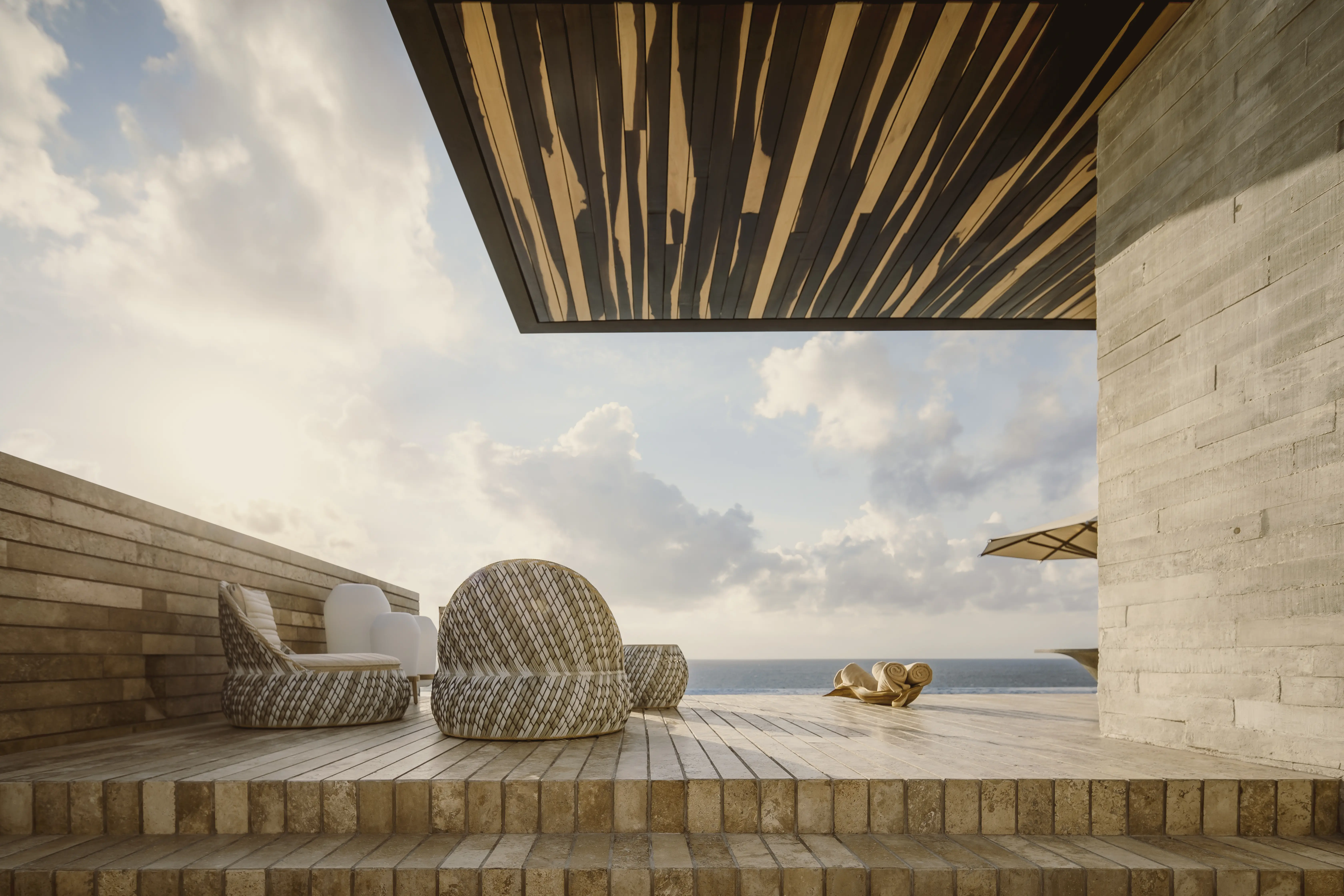 Terraza frente al mar en La Casa de la Playa Xcaret con mobiliario de exterior de lujo DEDON