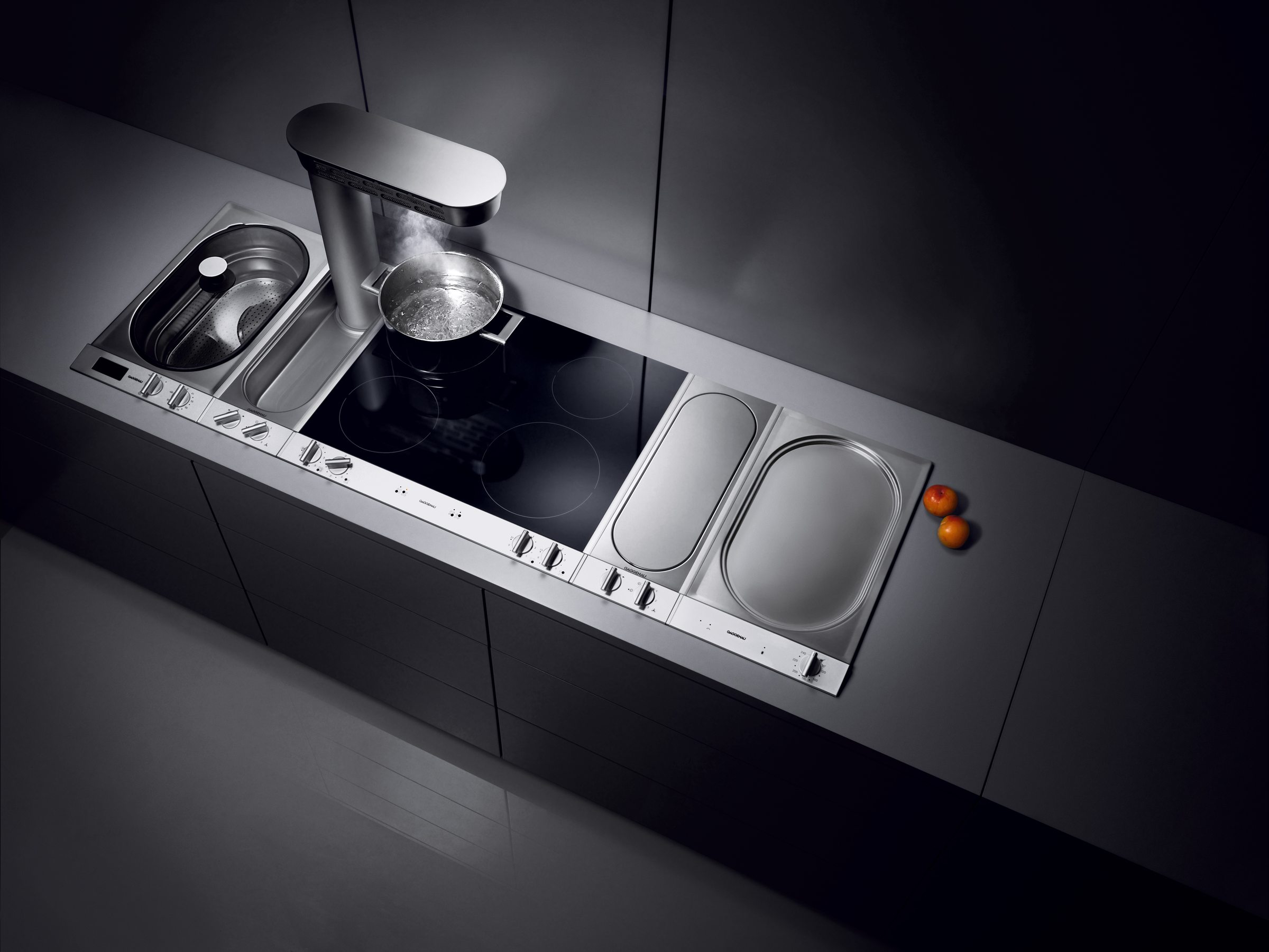 Sistema de cocción modular Gaggenau Vario con módulos de gas e inducción en un solo frente, disponible a través de Artexa México