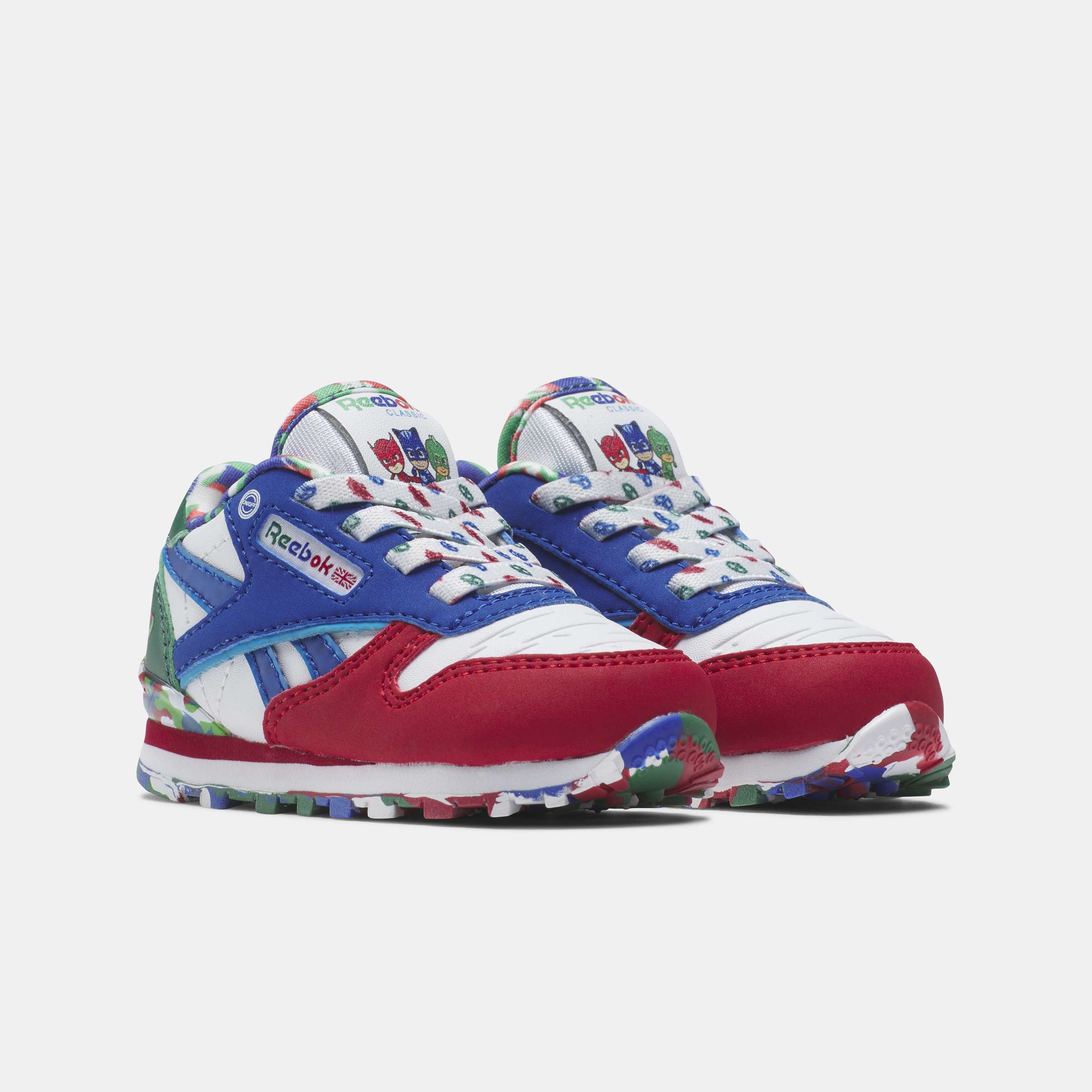 Los tenis Reebok para niños pequeños cuentan con colores y detalles divertidos, y tienen clips en el talón que se iluminan con cada paso. image number 2