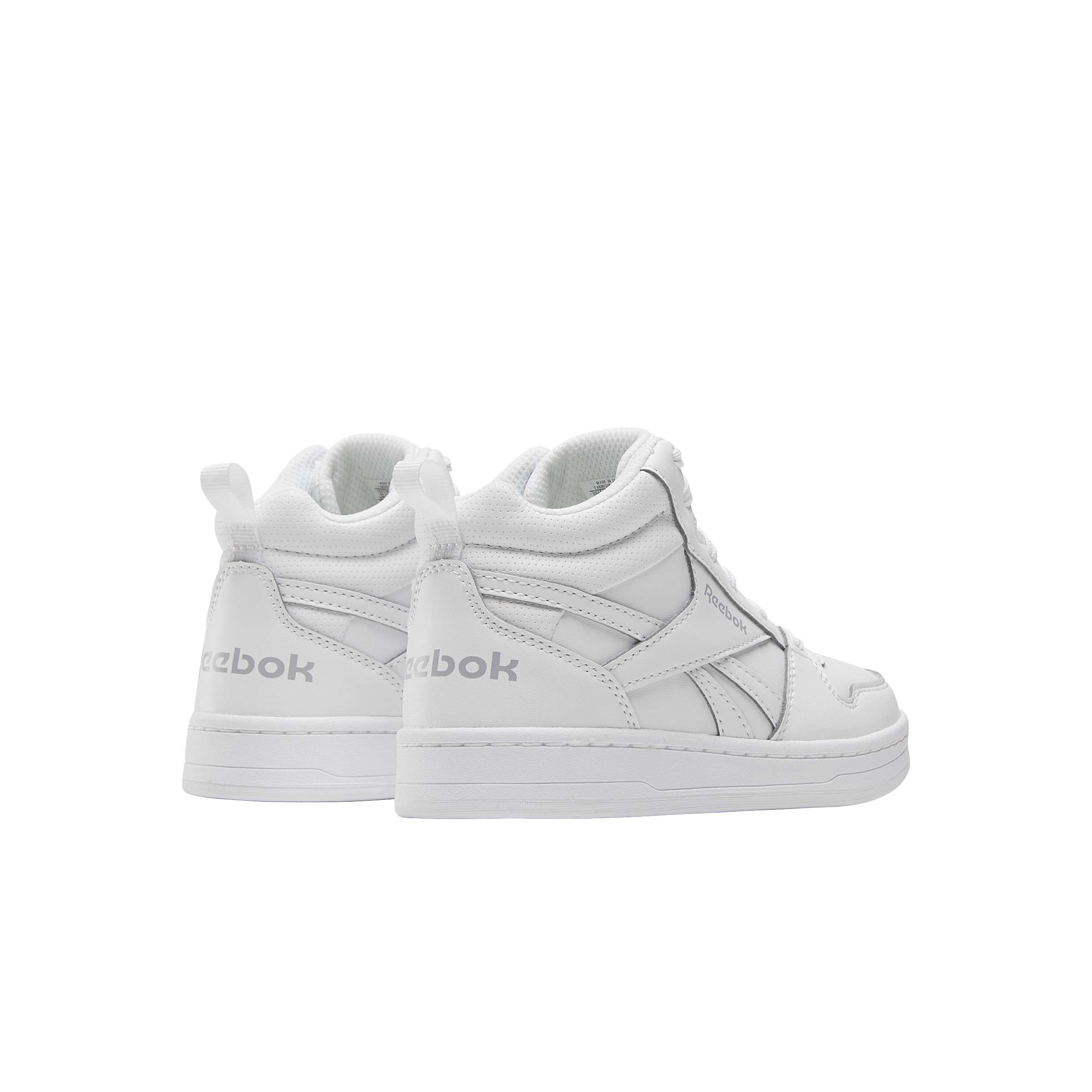 Estos tenis Reebok de corte medio para niños son perfectas para el niño que quiere llevar su estilo al siguiente nivel. image number 1