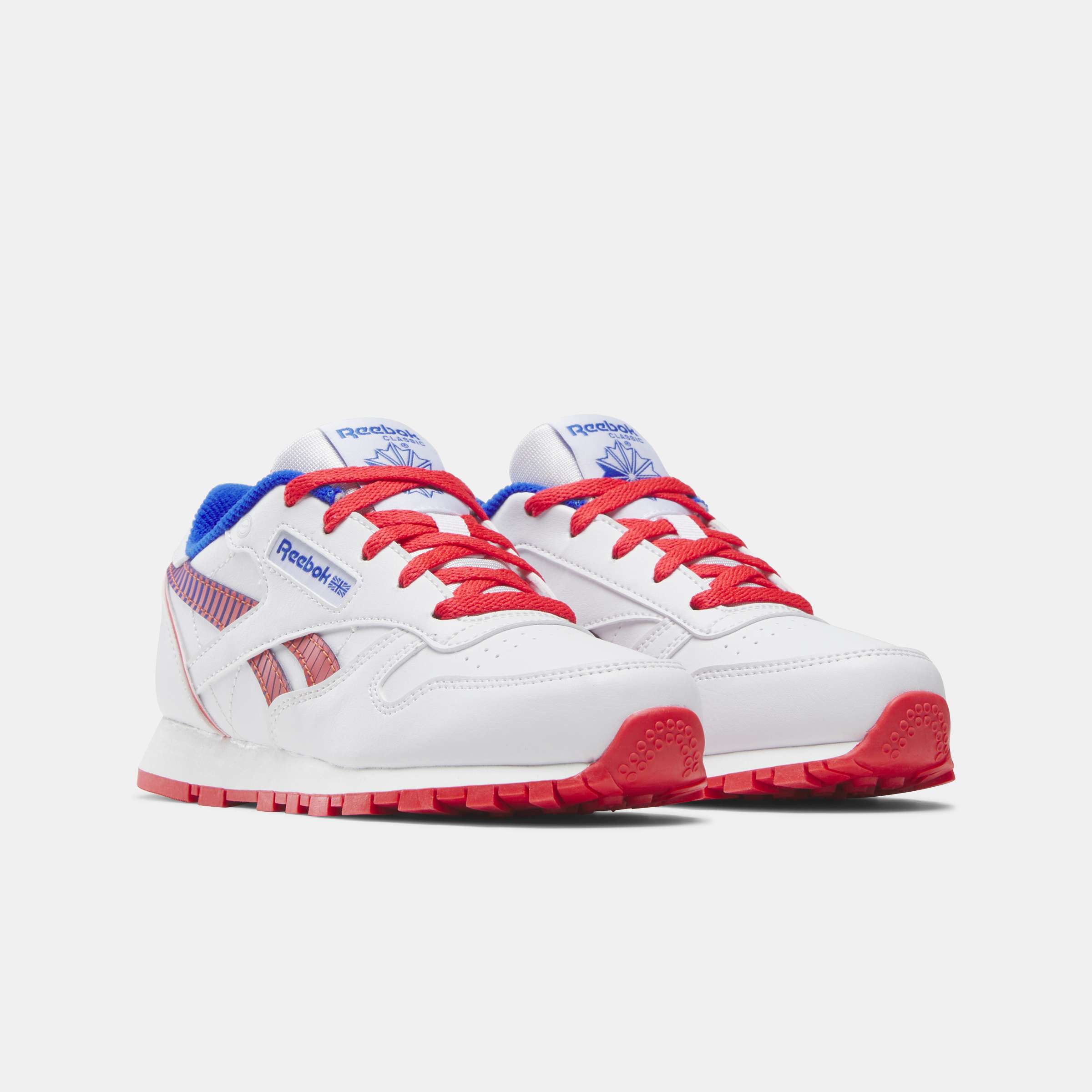 Los tenis Reebok para niños pequeños cuentan con colores y detalles divertidos, y tienen clips en el talón que se iluminan con cada paso. image number 1