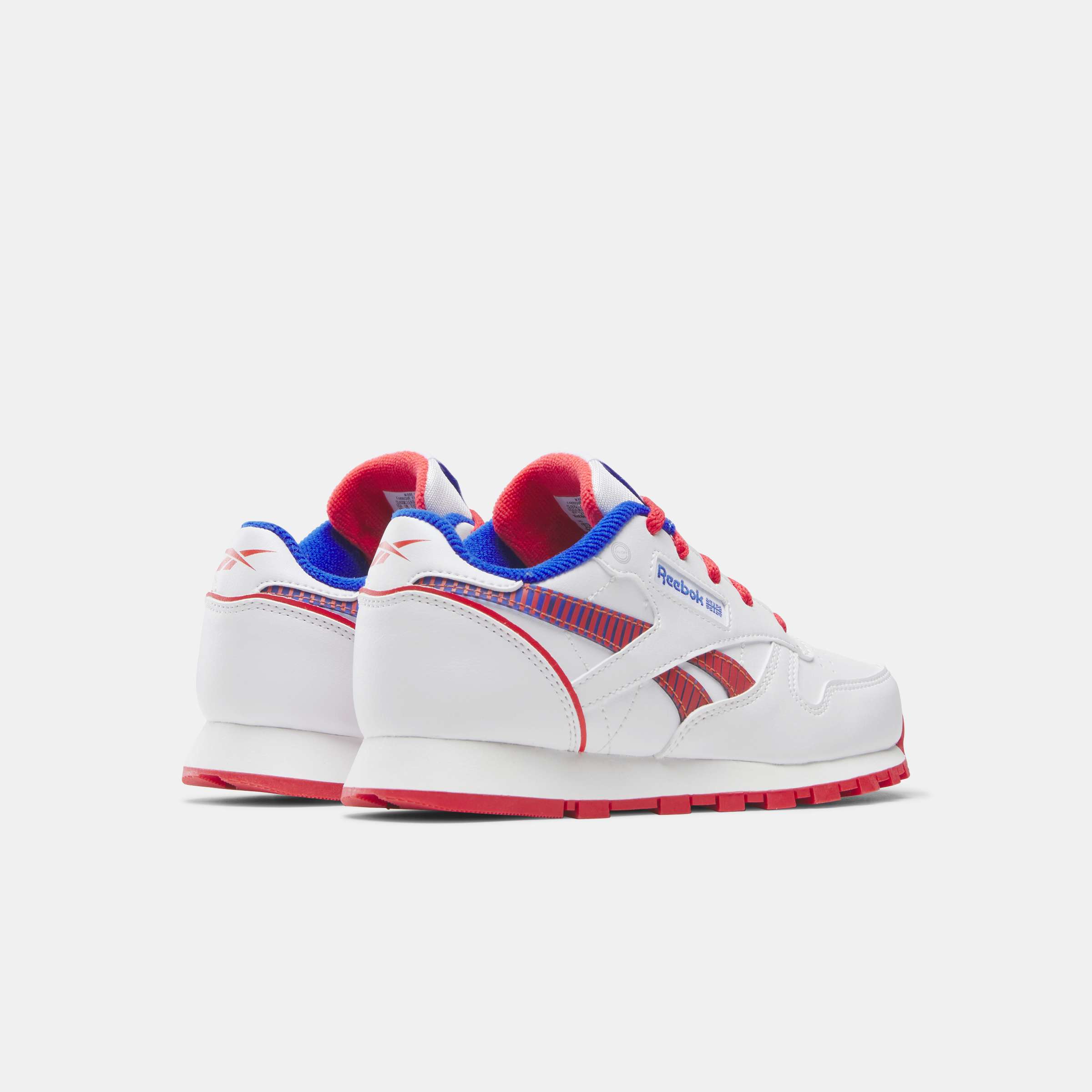 Los tenis Reebok para niños pequeños cuentan con colores y detalles divertidos, y tienen clips en el talón que se iluminan con cada paso. image number 2