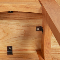 Detailed view of the underside construction of a solid wood end table.