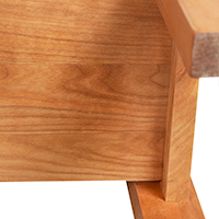 Detailed view of the underside construction of a solid wood end table.