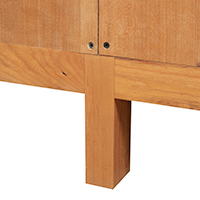 Detailed view of the leg construction of a solid wood open console bookcase.