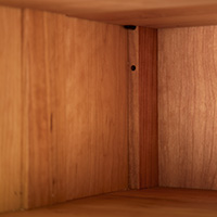 Detailed view of an adjustable bookcase shelf shelf.