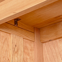 Detailed view of a bookcase top construction.