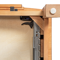 Detailed close-up image of a nightstand drawer slide mechanism.