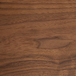 Detailed view of a natural walnut wood surface, showcasing the natural patterns and characteristics of the natural material.
