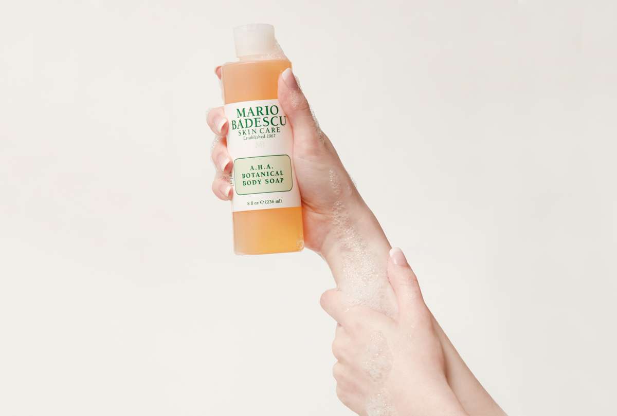 Washing skin with A.H.A Botanical Body Soap