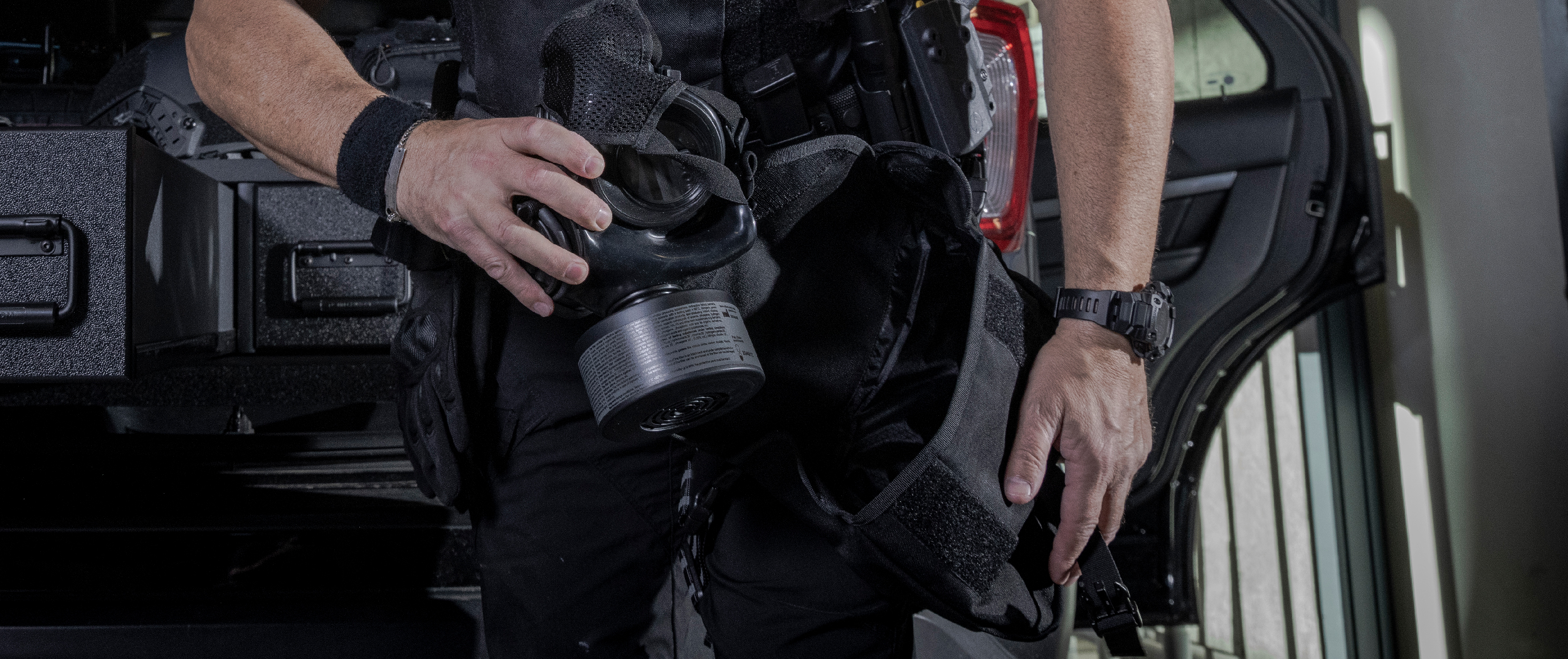 Image of someone putting their mira mask in their pouch