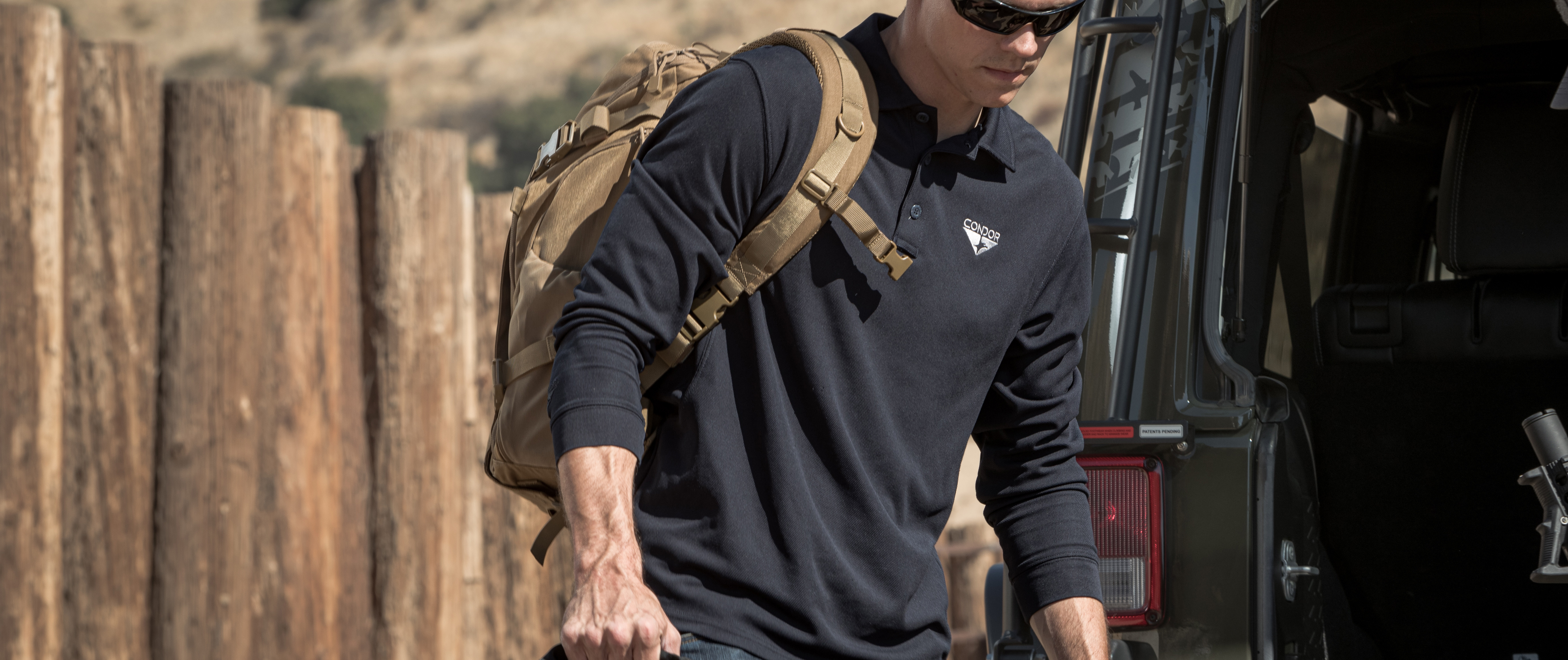 Image of someone wearing the performance tactical polo at the range.