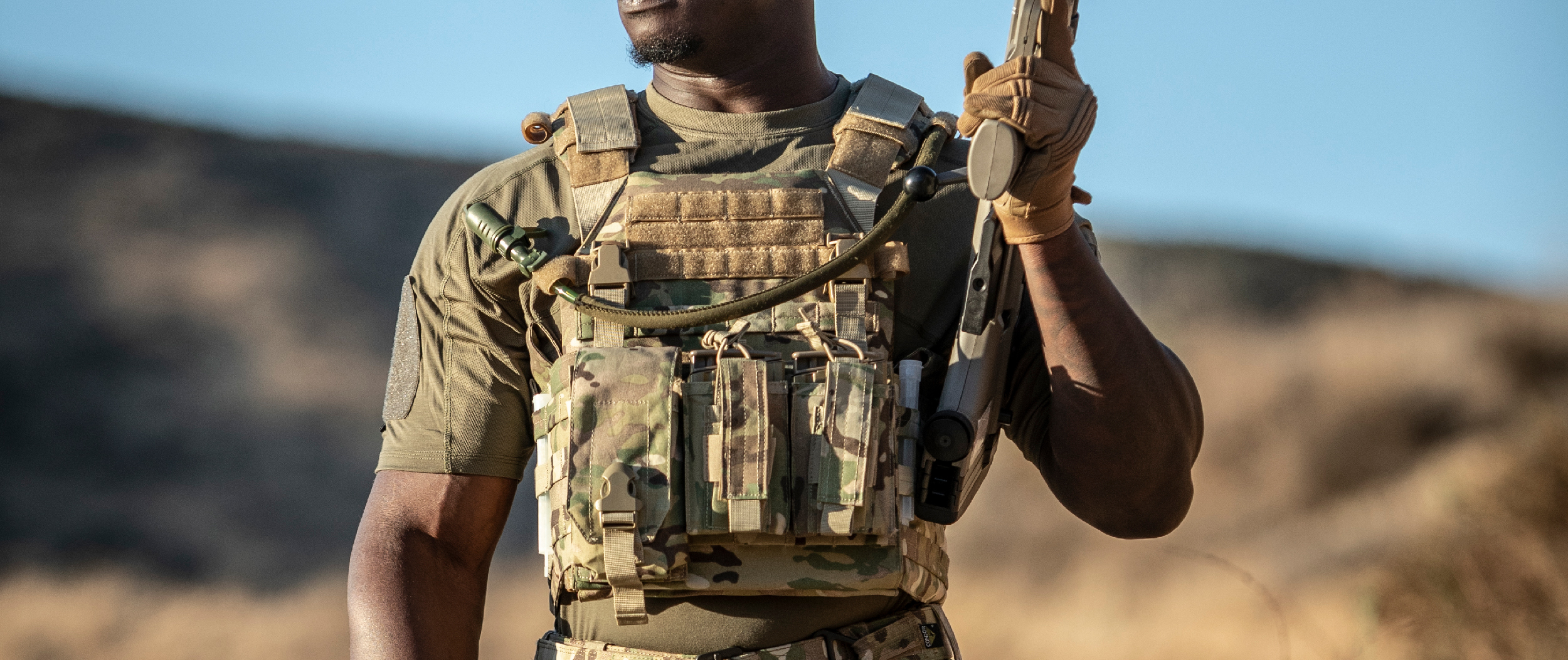 Image of the vanquish plate carrier being worn by a muscular guy in a short sleeve shirt
