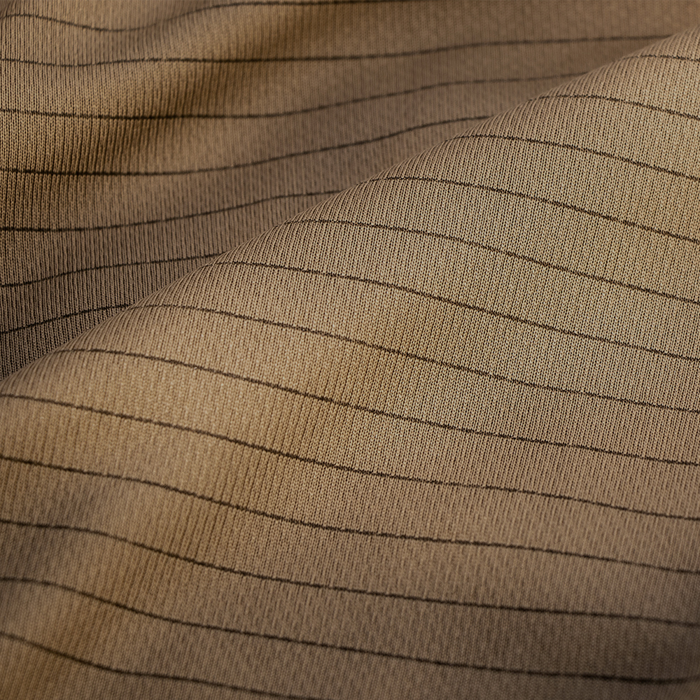 close up of the charcoal infused fabric on the long sleeve training top