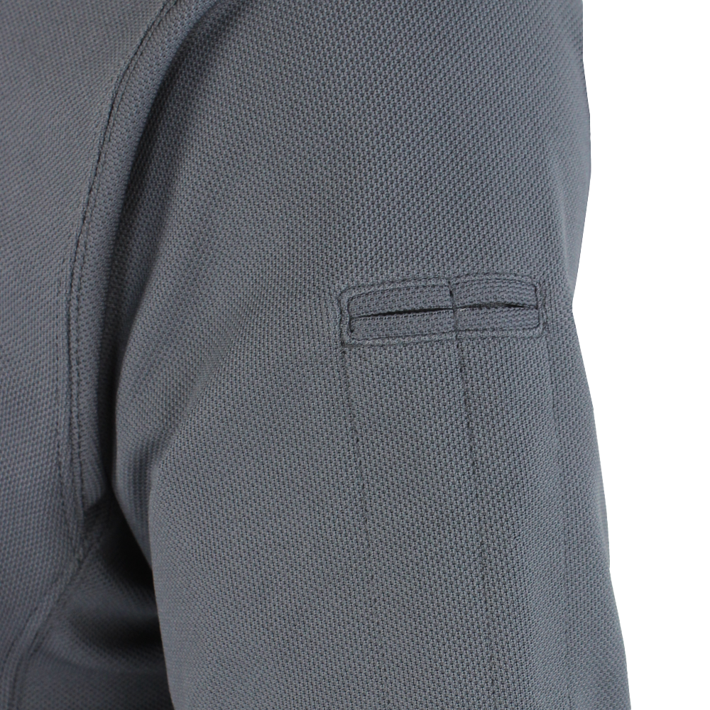 close up image of the pen  pockets on the sleeve of the polo shirt