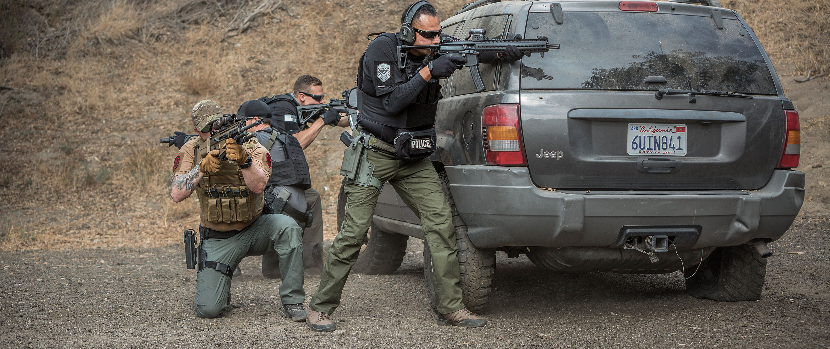 Image of two people shooting at a range while wearing the stealth operator pants