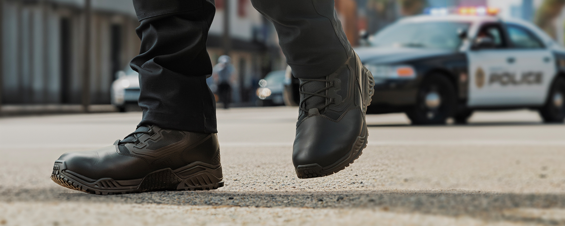 Image of a police officer wearing the 8inch tactical boots in black