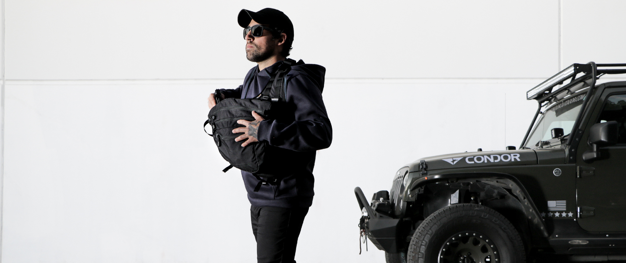 image of someone drawing from concealed carry in the sector sling pack