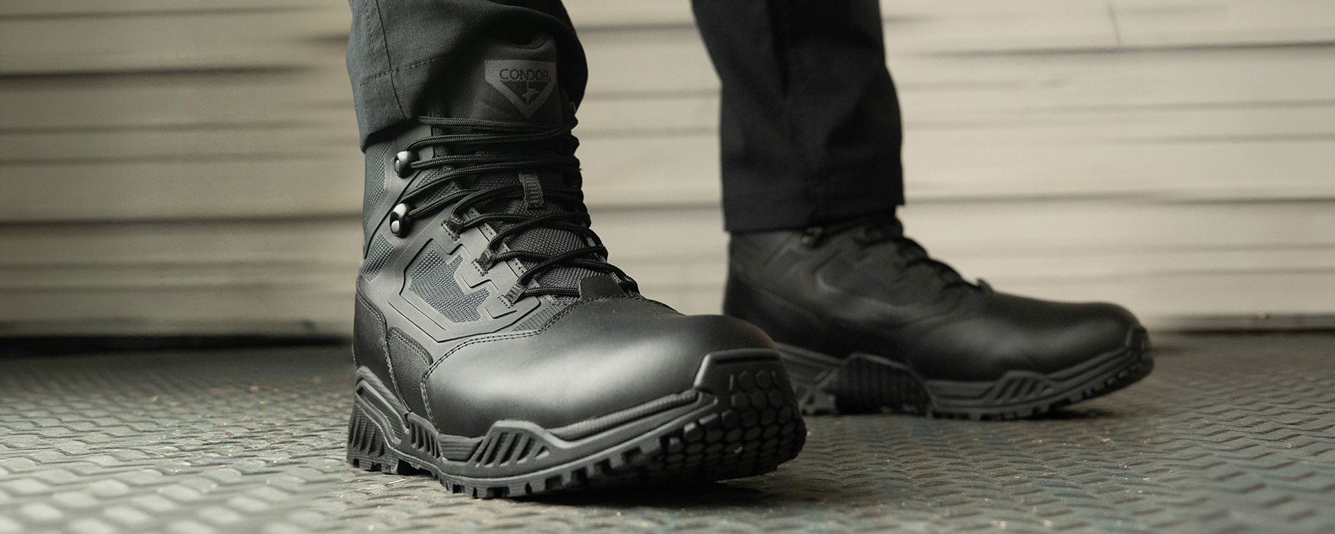 Image of someone wearing the 6 inch black brigade tactical boots in what looks like a warehouse