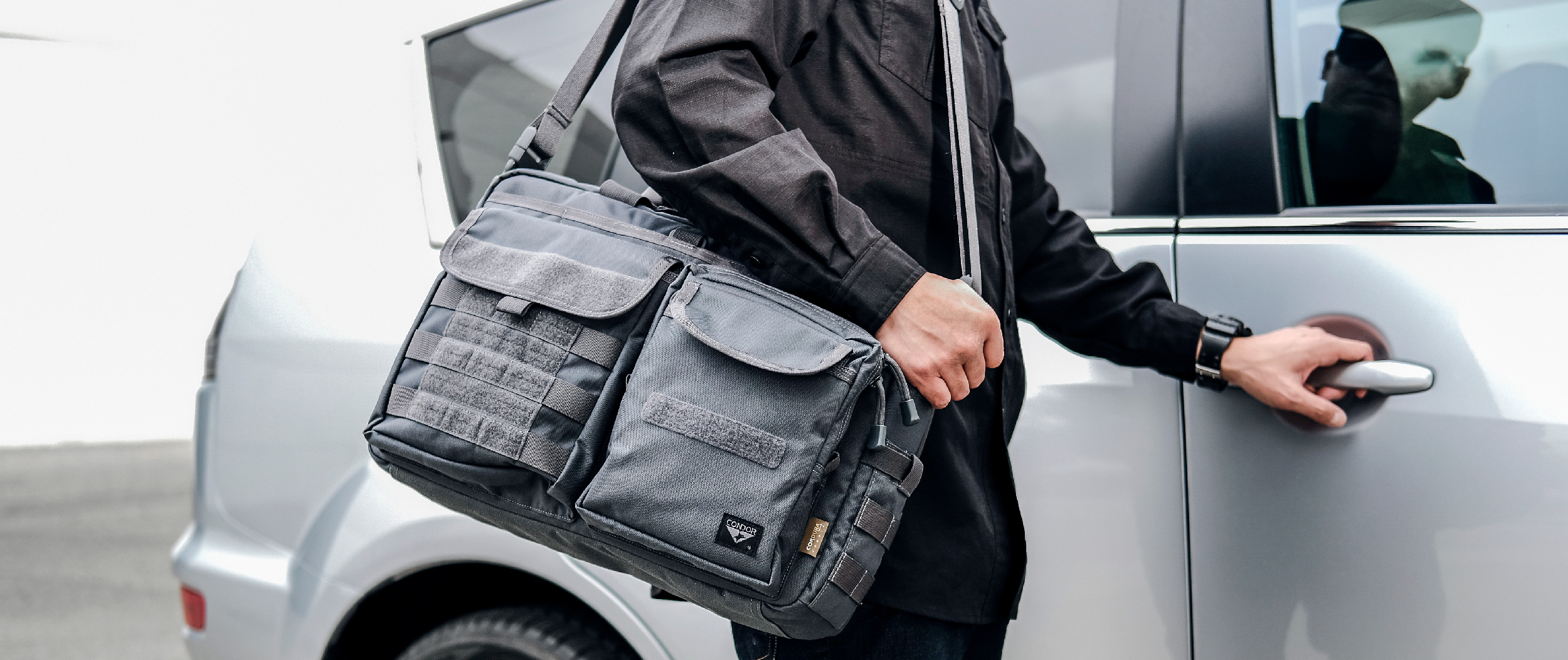 Image of someone opening their car wearing the tactical briefcase