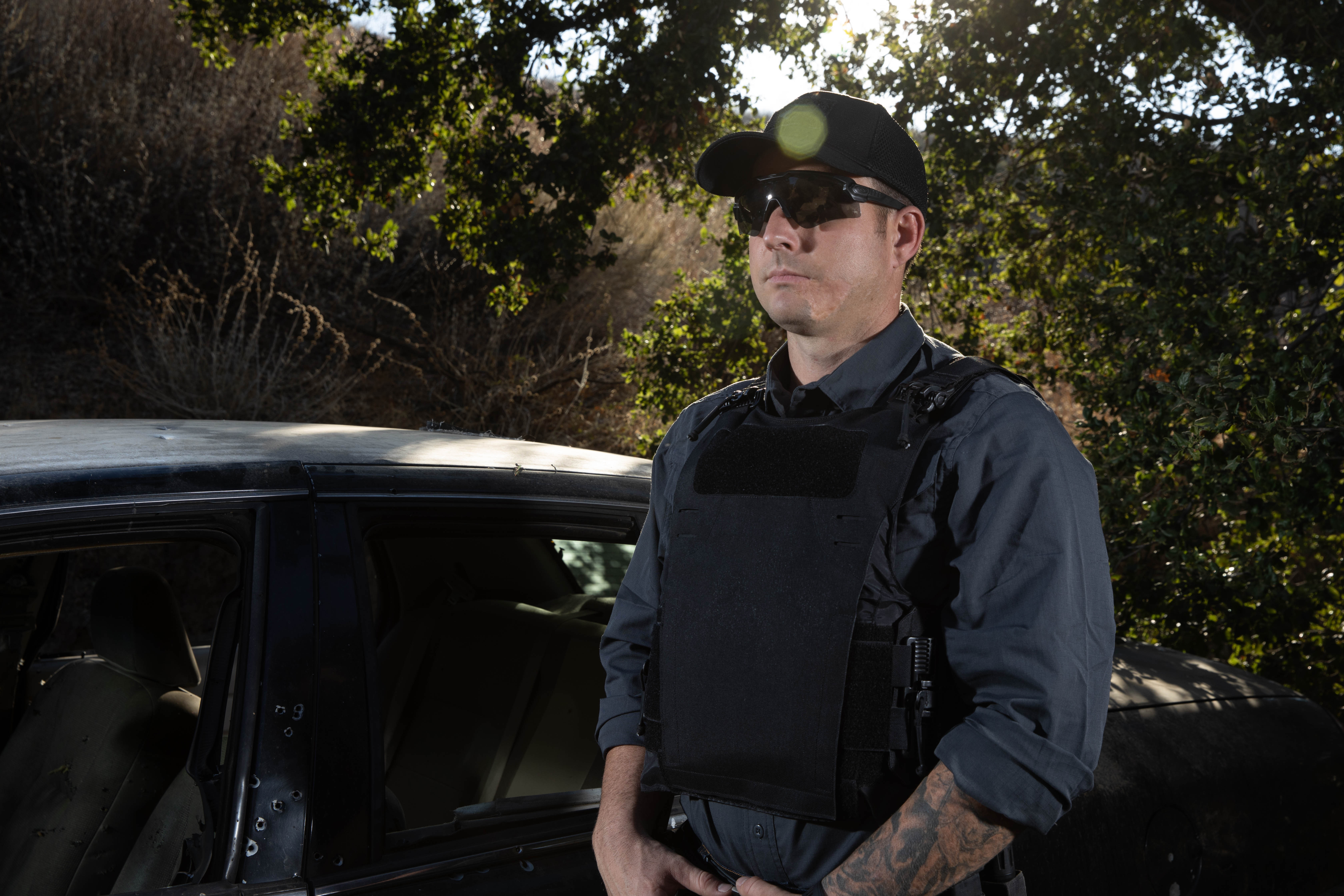 Image of a person in a vanquish LT standing with a vector sub machine gun