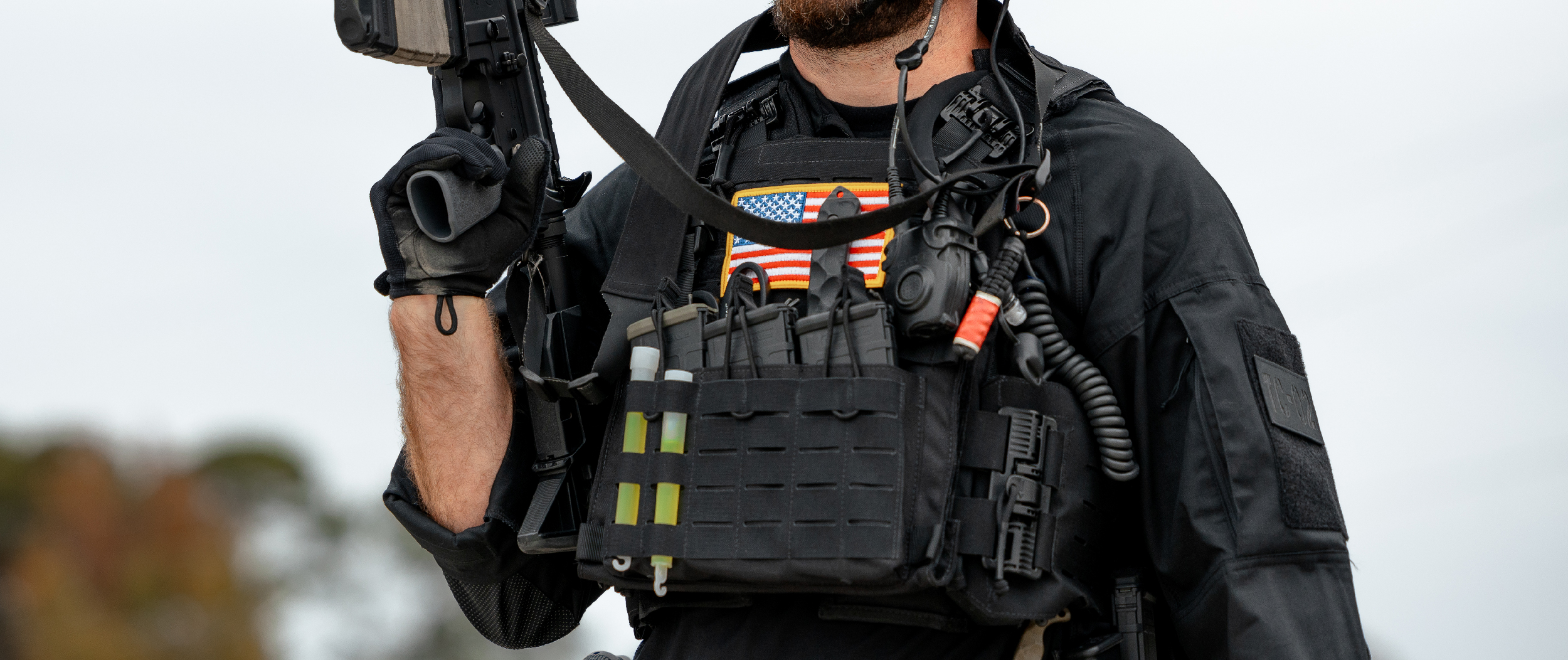 Image of a swat officer using the panel on the RS cummerbund