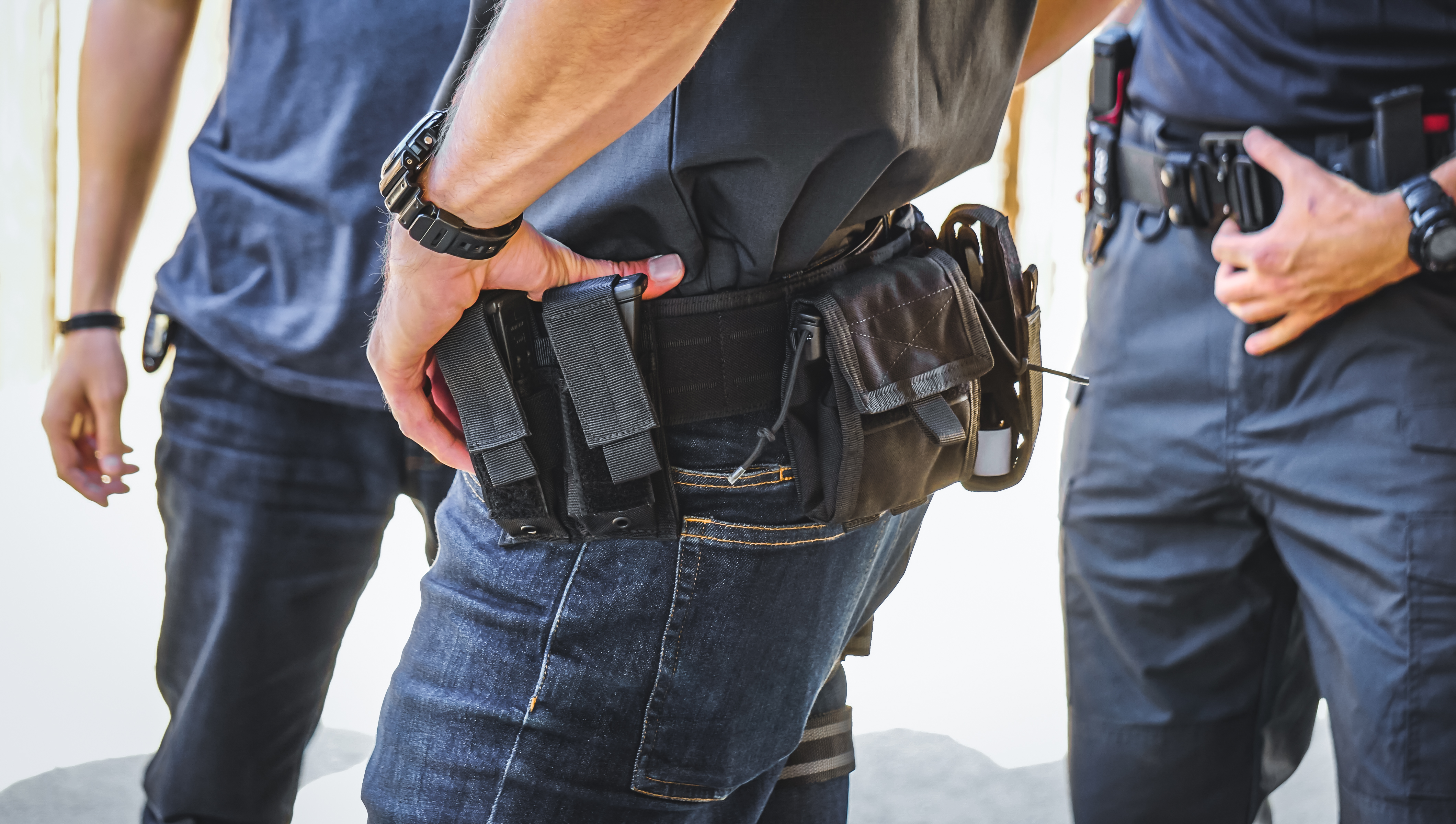 Image of a close up duty belt where the focal point is the double pistol mag pouch