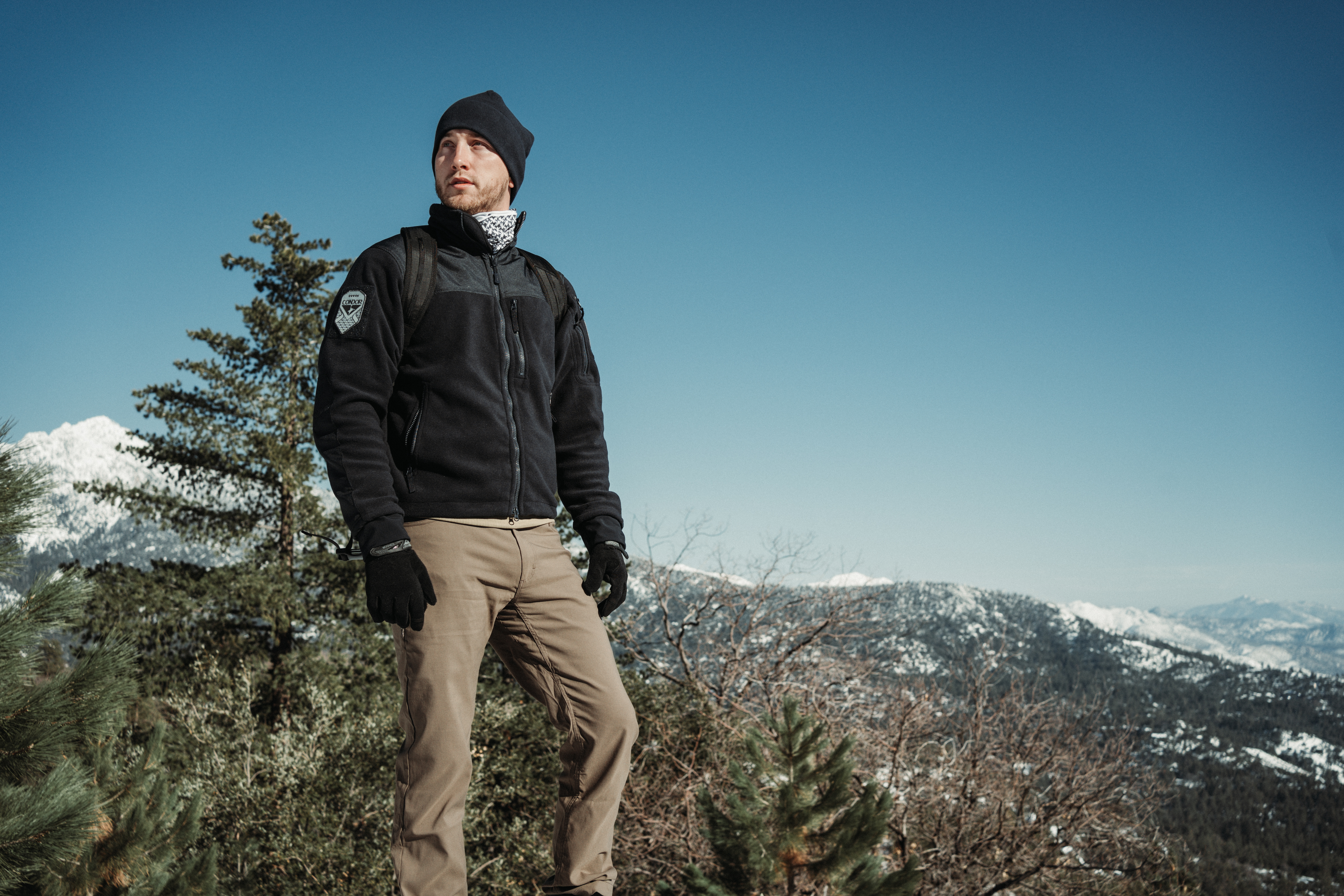 Image of a person with a mountain in the background wearing the bravo fleece