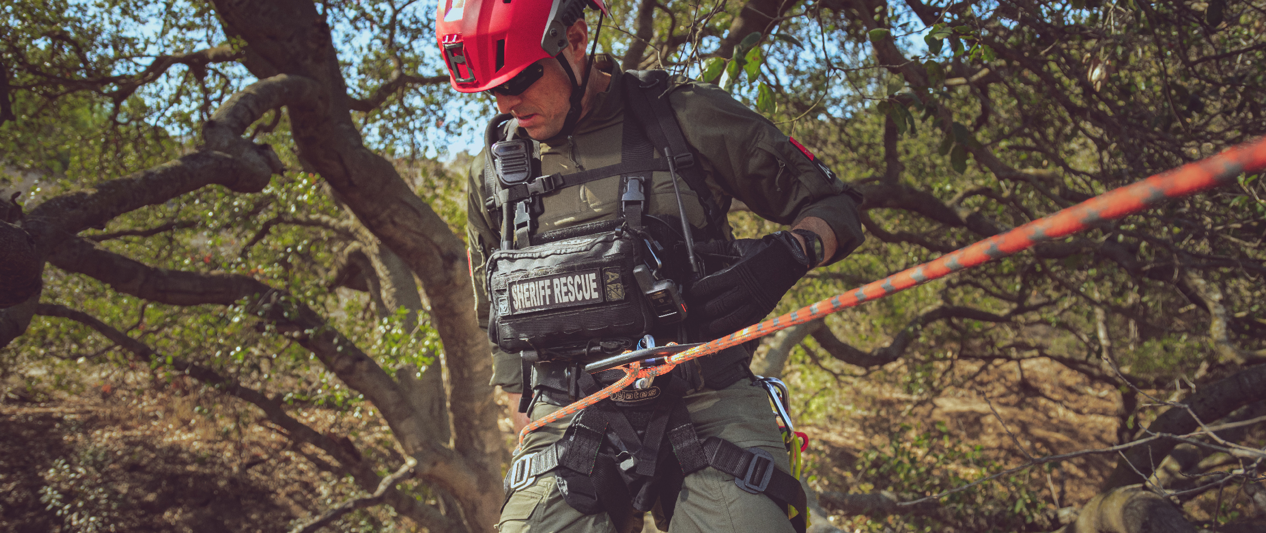 Image of a sheriff using a harness along with the stowaway chest rig
