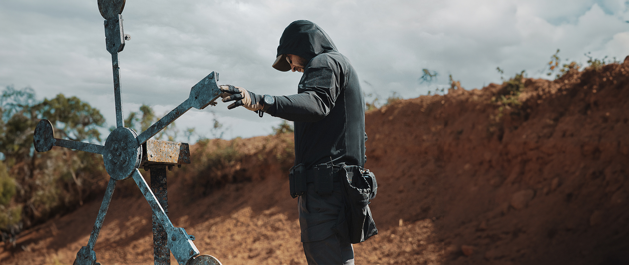 Image of someone shooting at a range with their tactical sun shirt