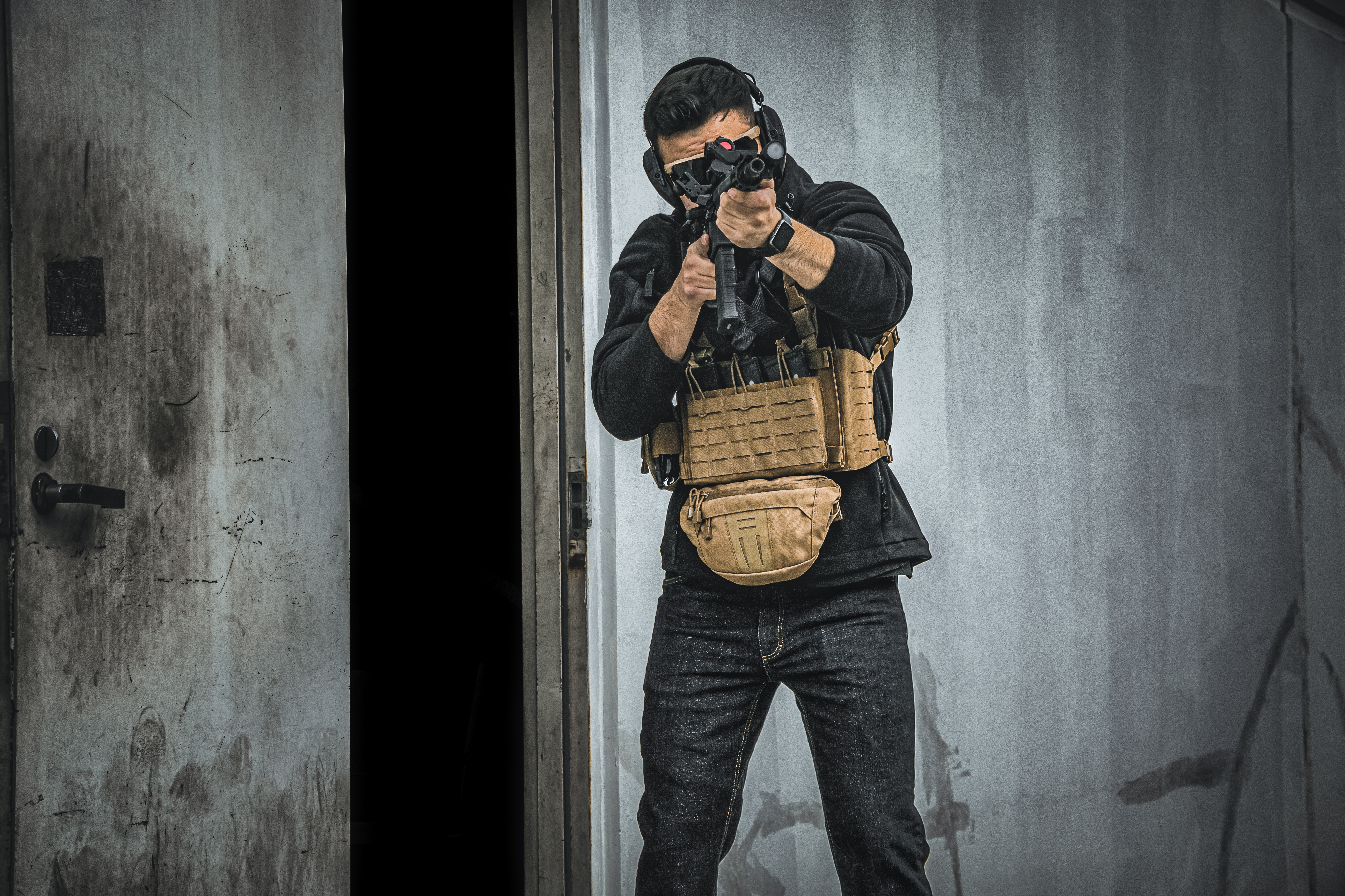 image of a few of the variation s of the chest rig laid out on the ground