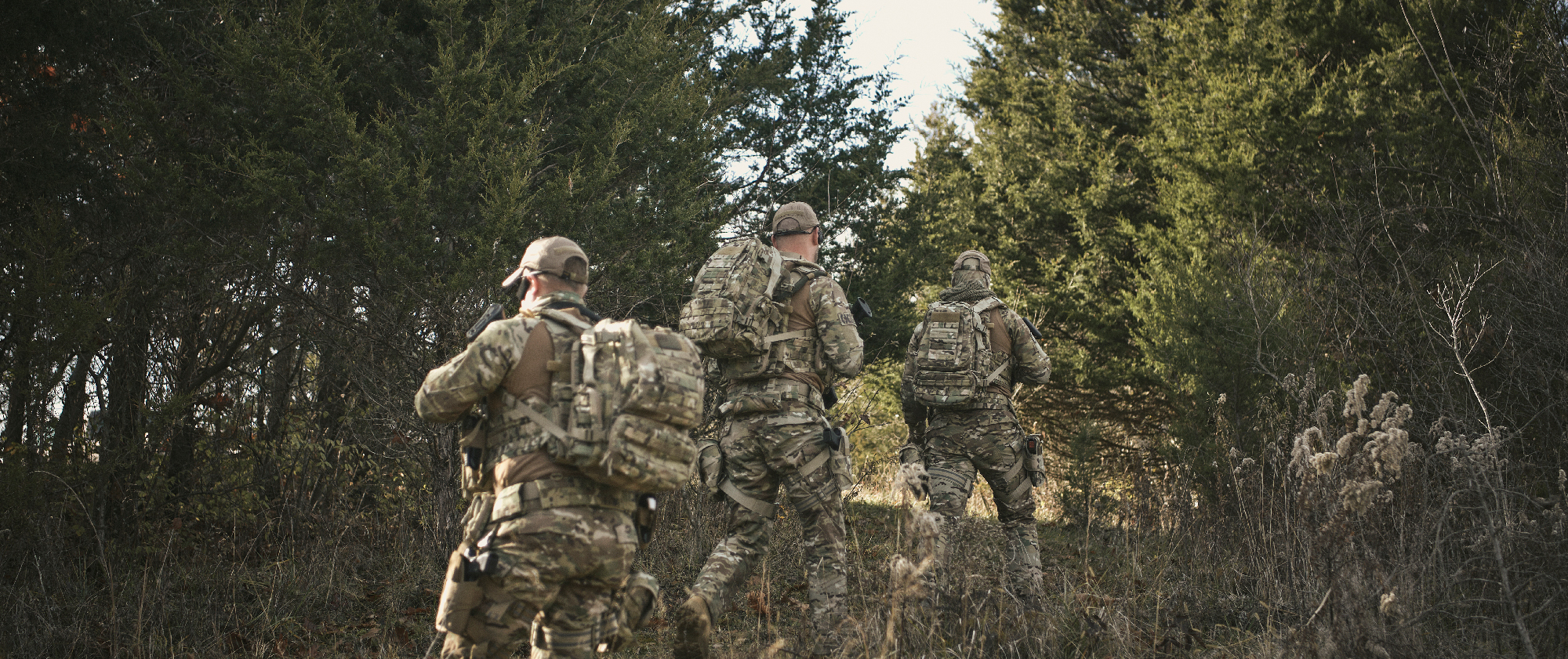 image of a sniper team moving while wearing convoy backpacks