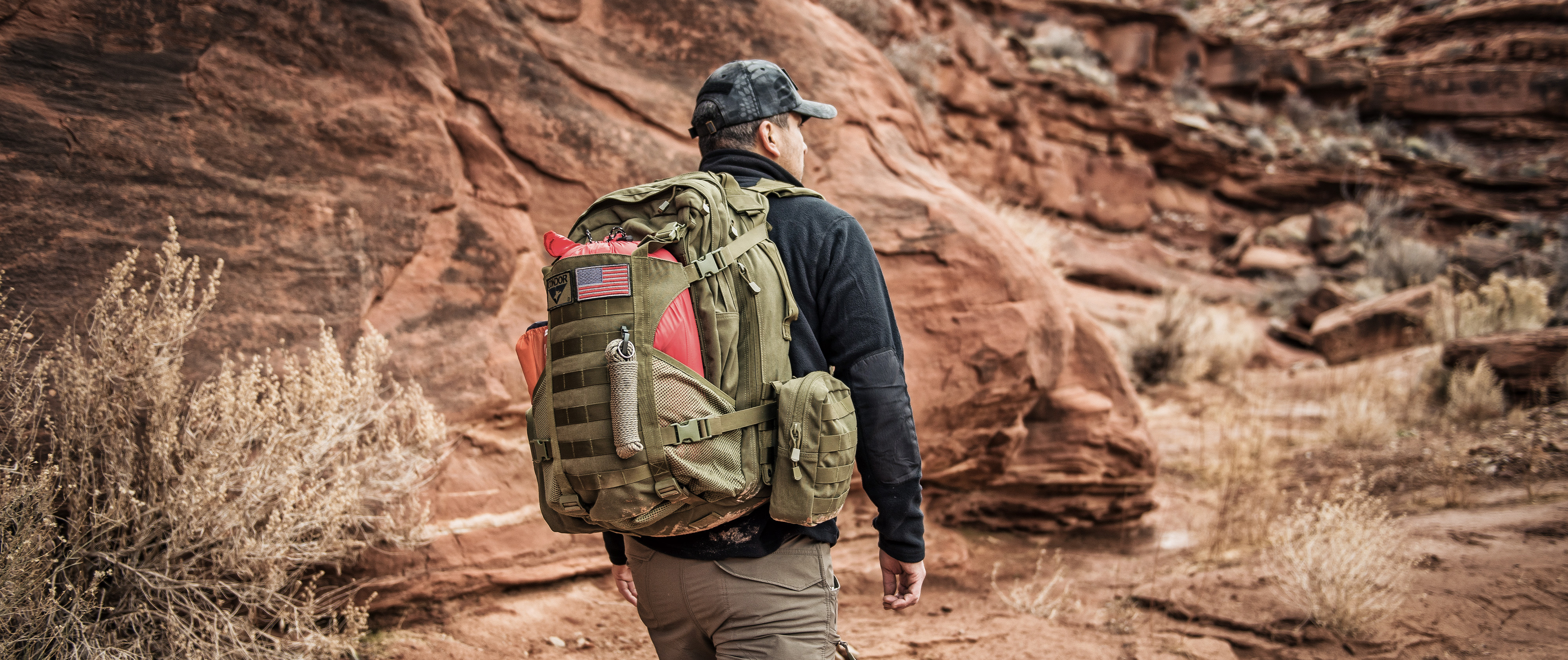 Image of a man in a canyon using the orion assault pack