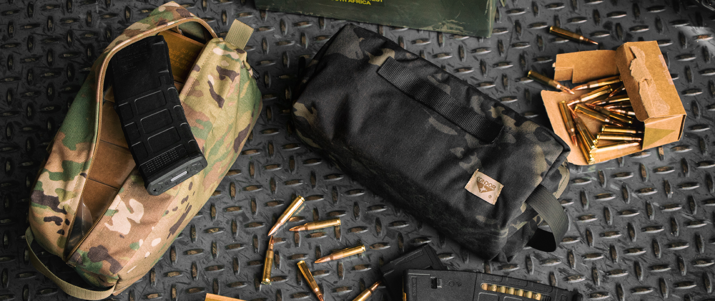 Image of a scorpion kit bag next to a multicam black kit bag