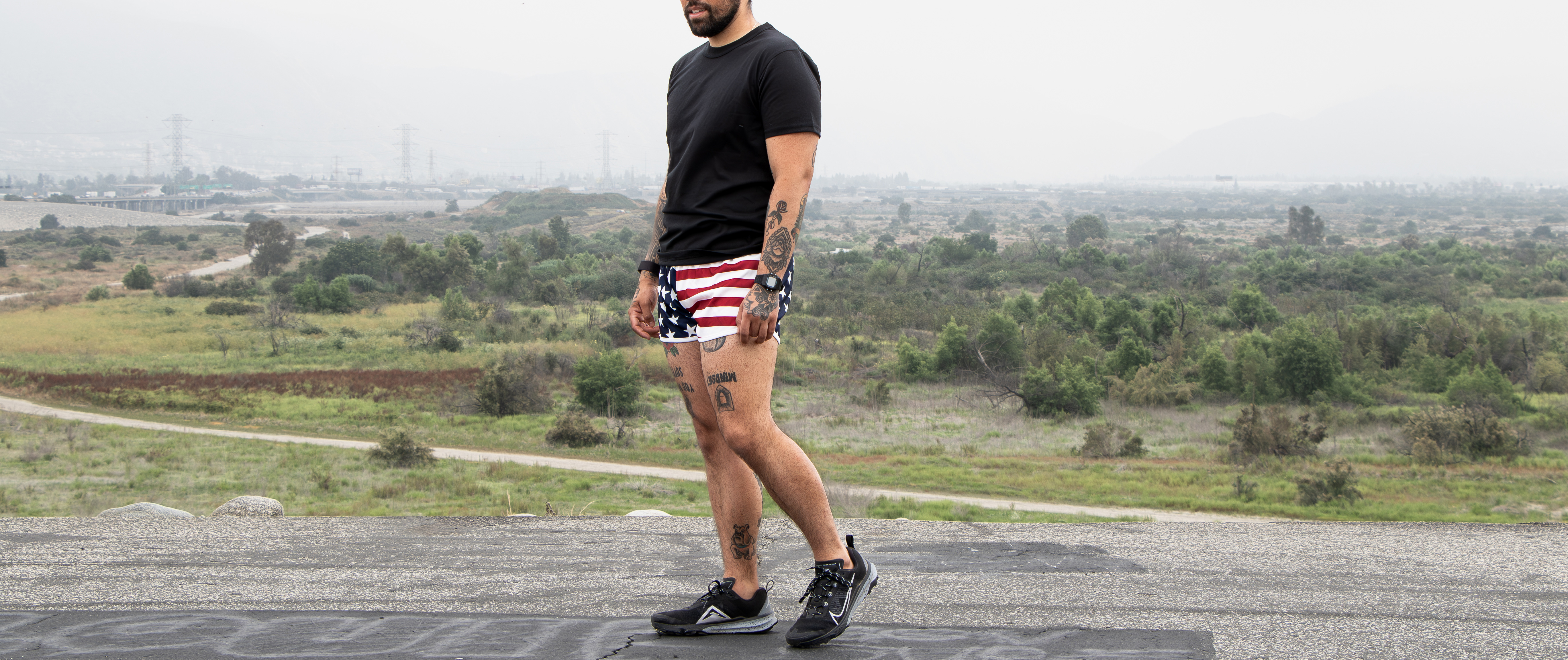 image of a man on a track getting ready to run in the american flag running short ranger panties.
