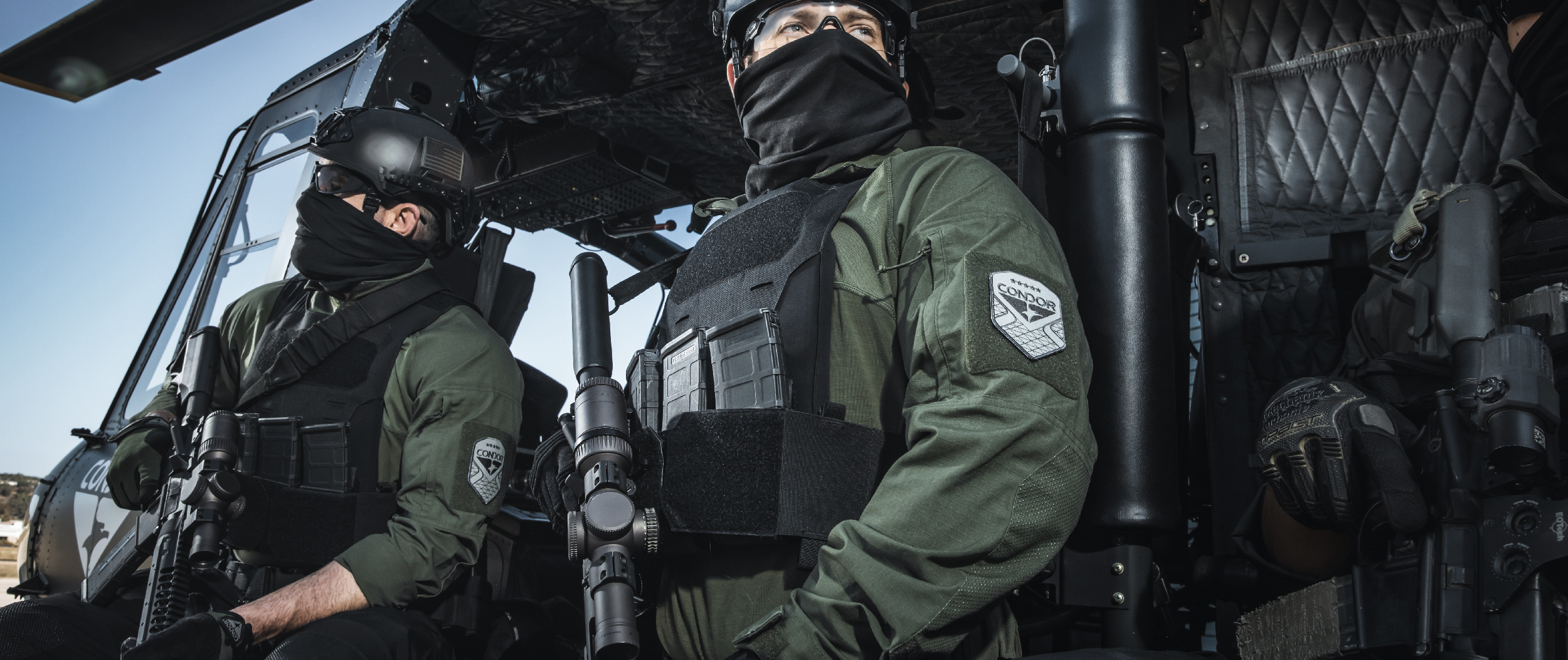 Image of guys in a helo using the specter with the kangaroo pouch