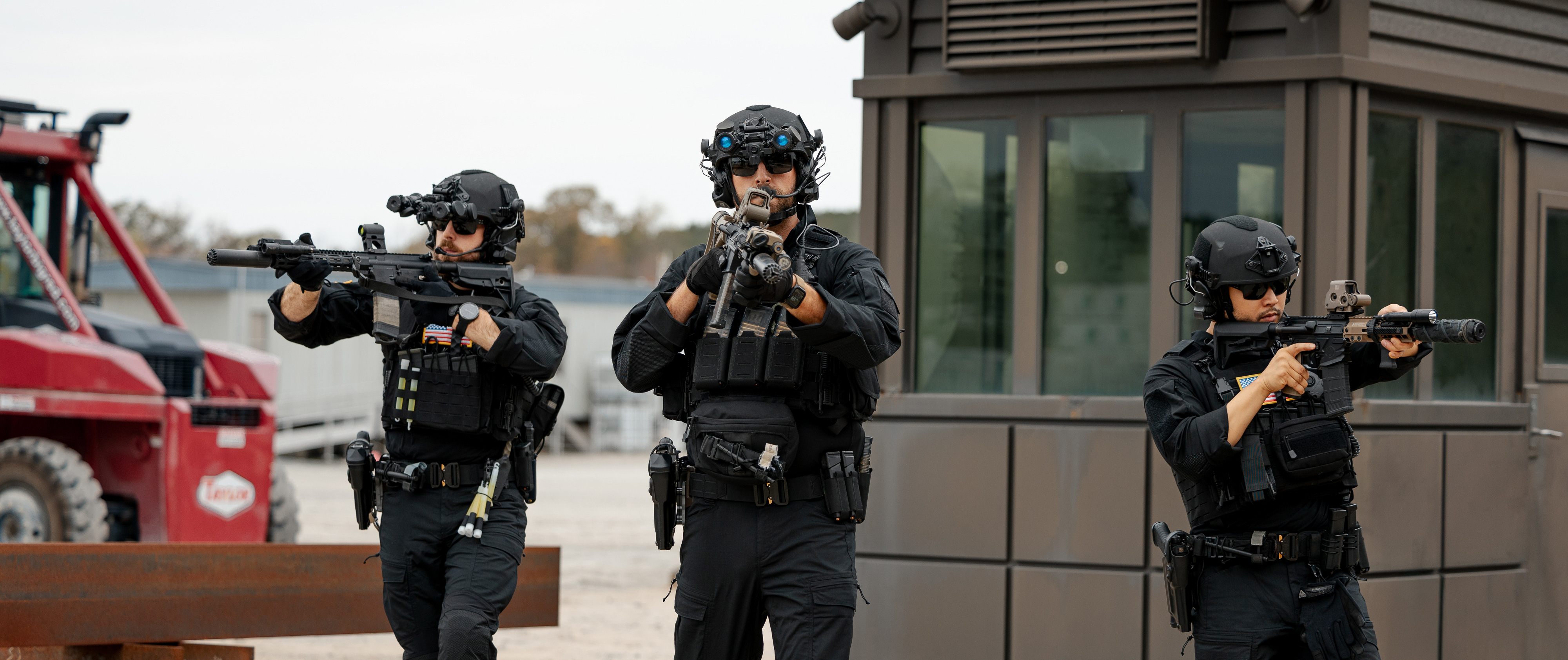 image of three swat officers moving forward while wearing long sleeve combat shirts