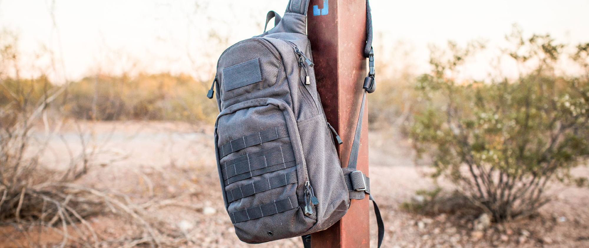 Image of a fuel hydration pack hanging on a pole in the desert.