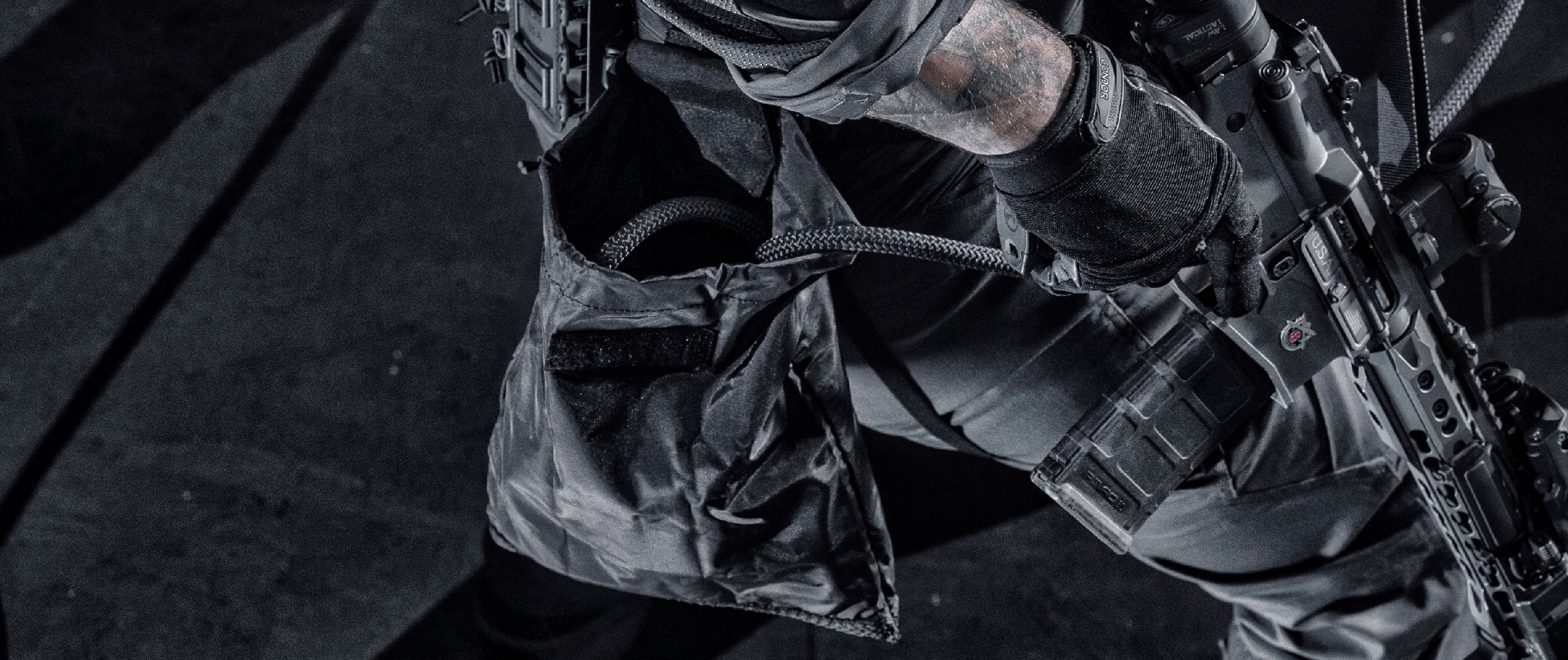 Image of a guy breaching with the micro dump pouch open