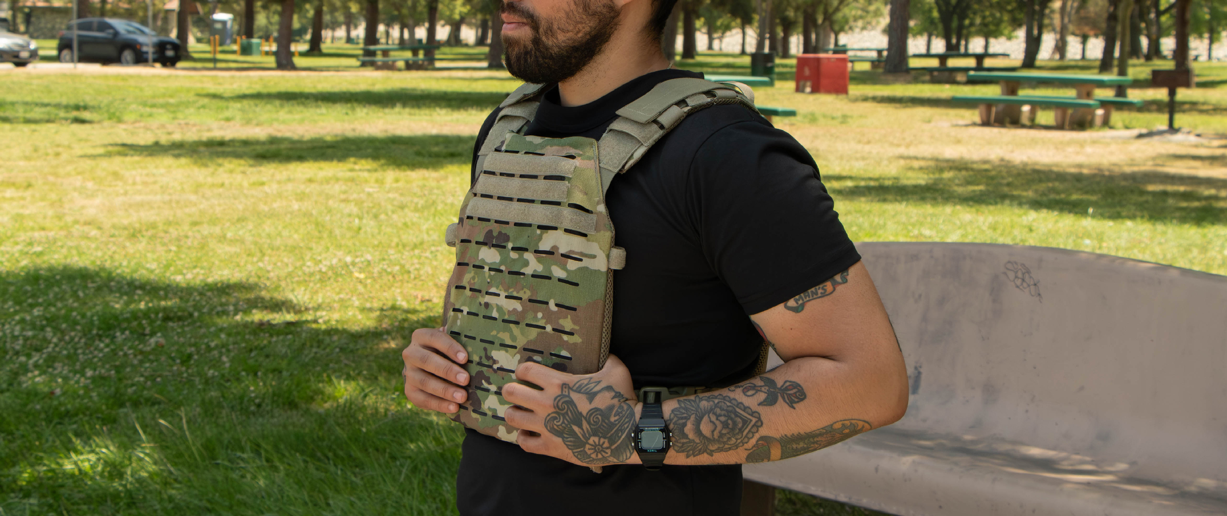 Image of someone working out at the park wearing the lcs sentry plate carrier.