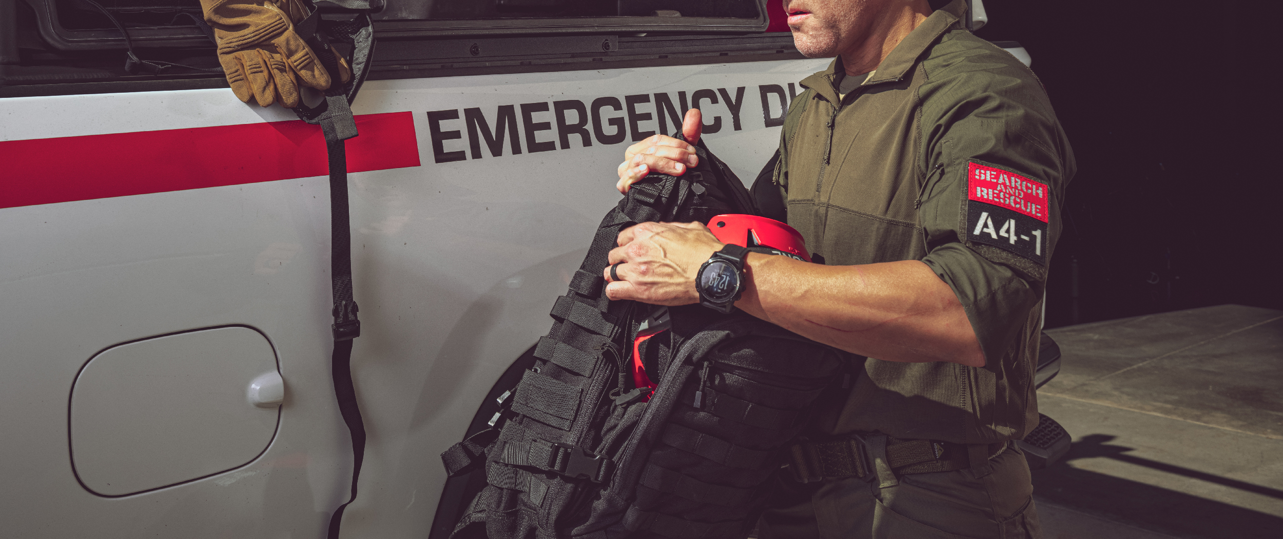 Image of a search and rescue guy messing with the venture bag