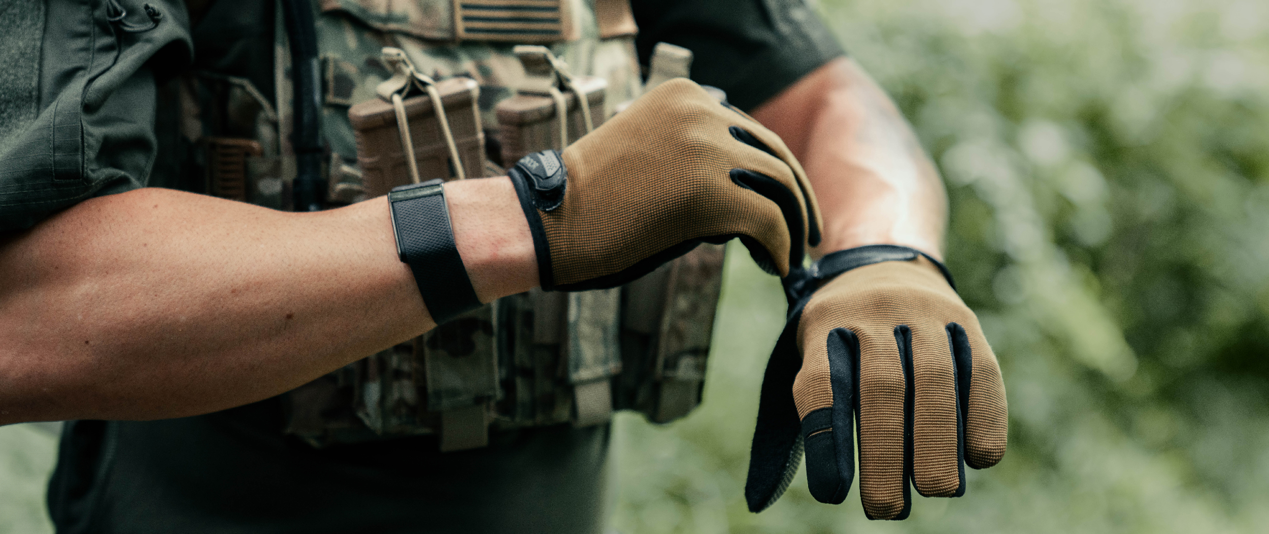 Image of someone adjusting their shooter gloves