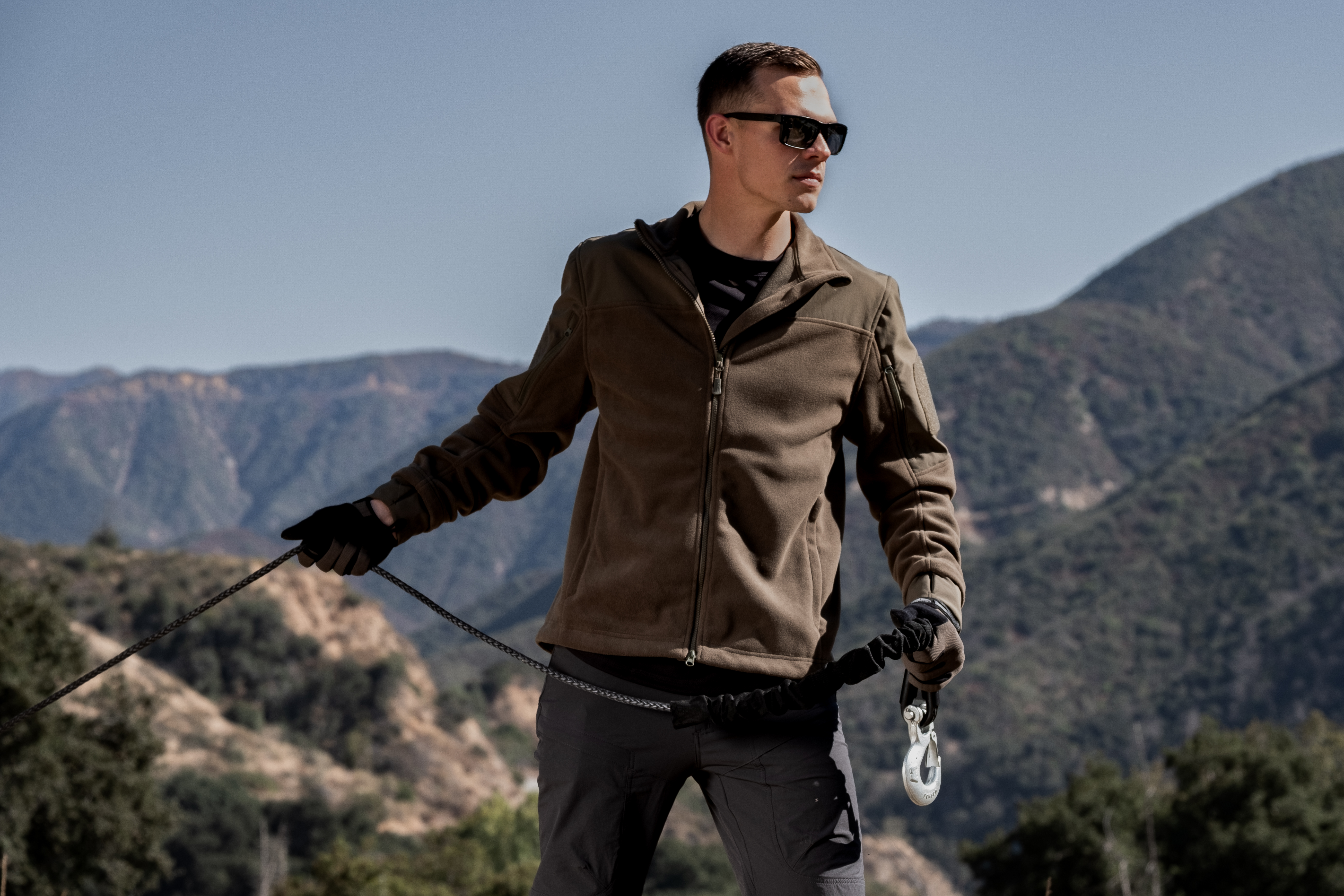 Image of a person walking in the snow wearing the bravo fleece jacket