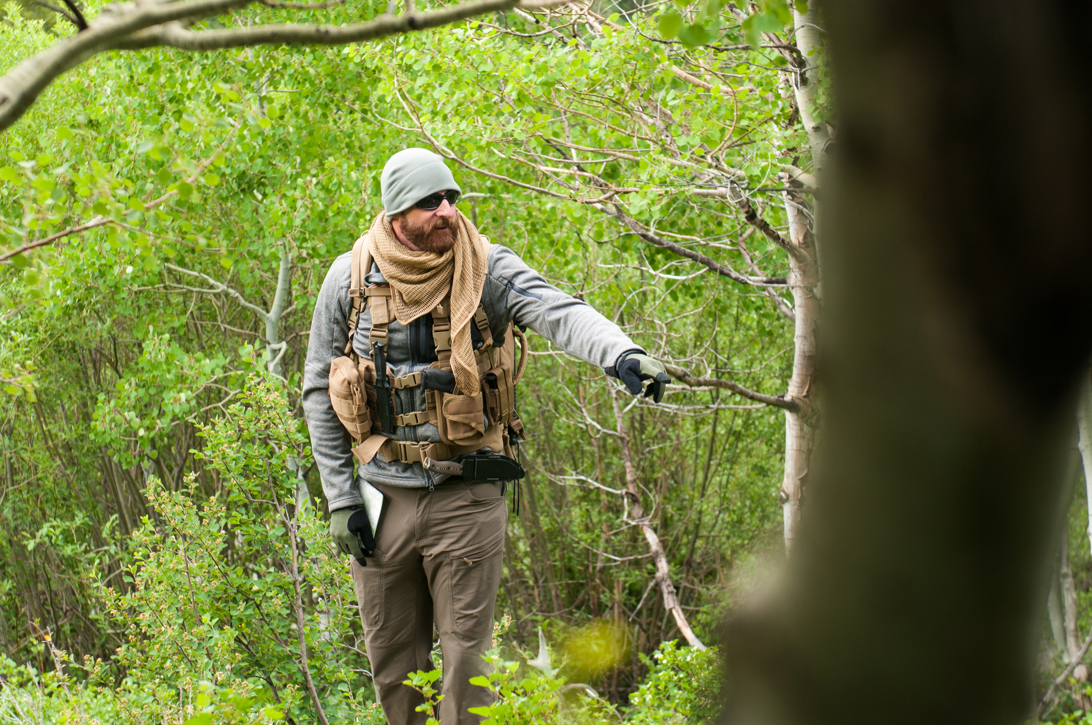 image of a bushcrafting person wearing the ronin chest rig