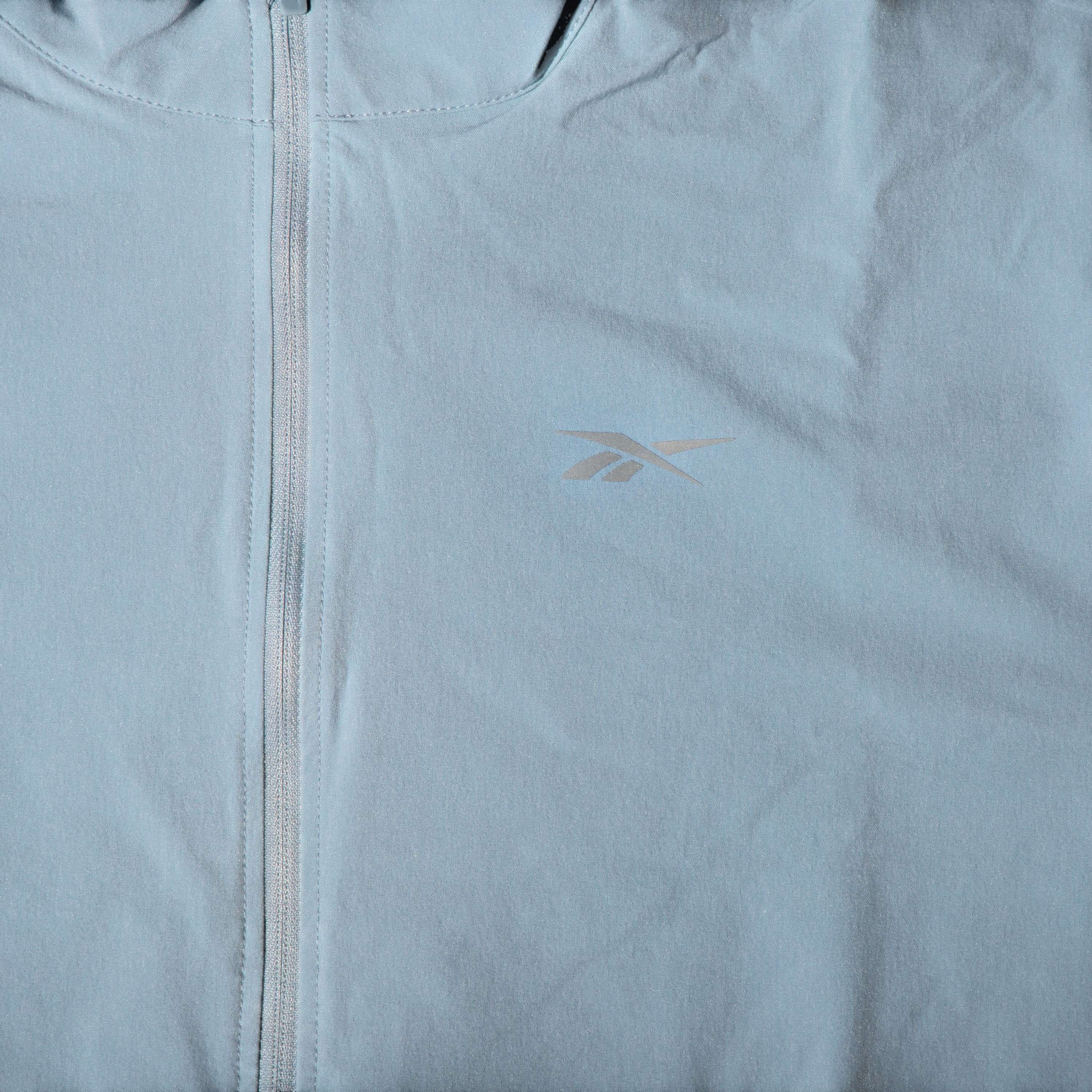 Chamarra running windbreaker en corte cropped