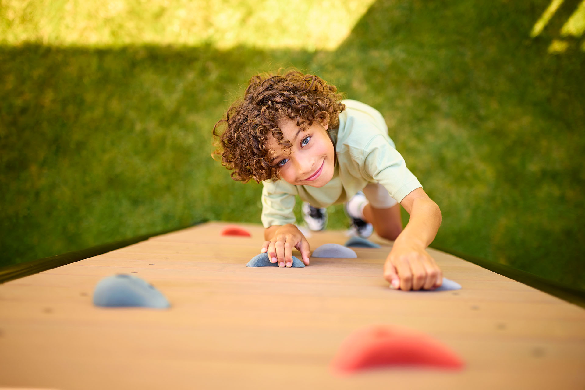 Children playing on BERG PlayBase climbing frame with accessories — Play Climbing Frames Ireland